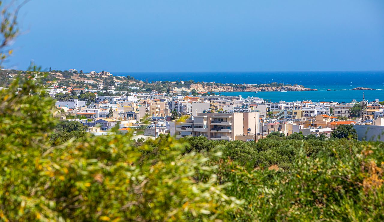 Heraklion seafront apartments and the Cretan coast seen from a hillside