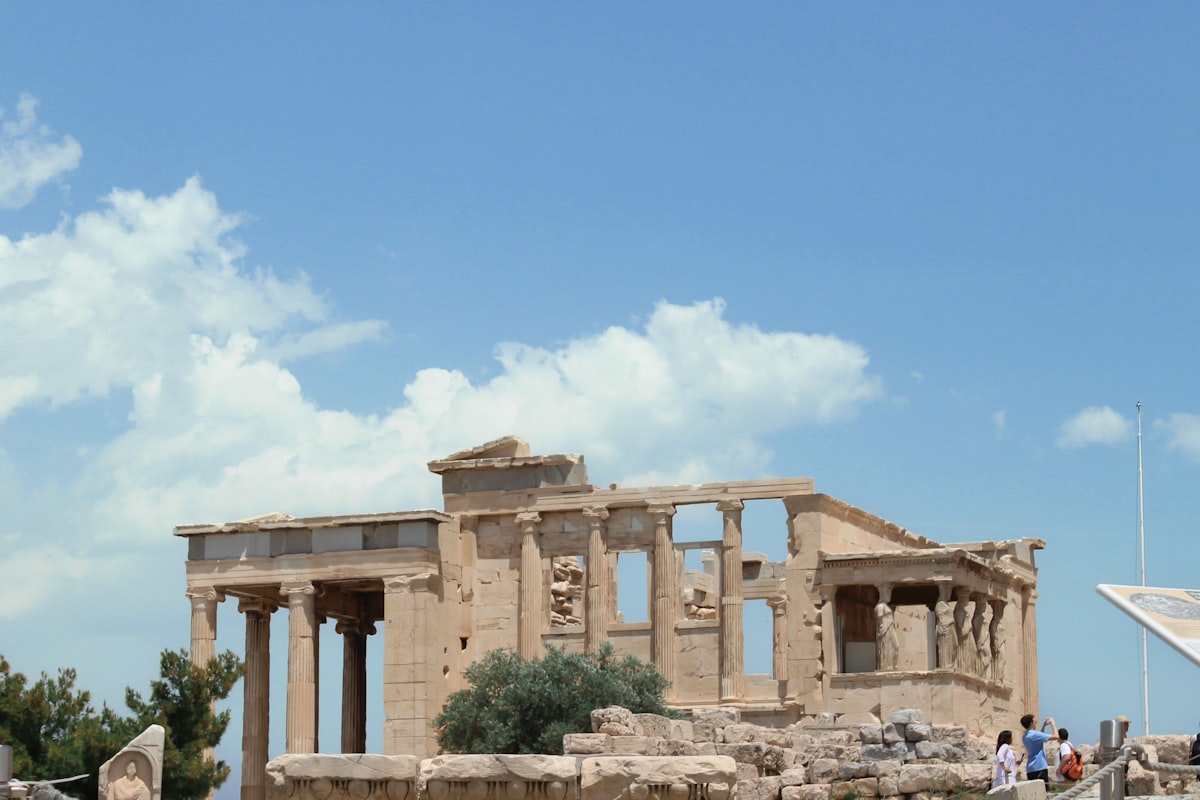 The Erechtheion temple on the Acropolis of Athens under a clear blue sky