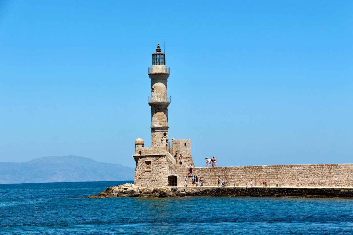 The Egyptian lighthouse at the end of the Venetian breakwater in Chania harbour, Crete, Greece