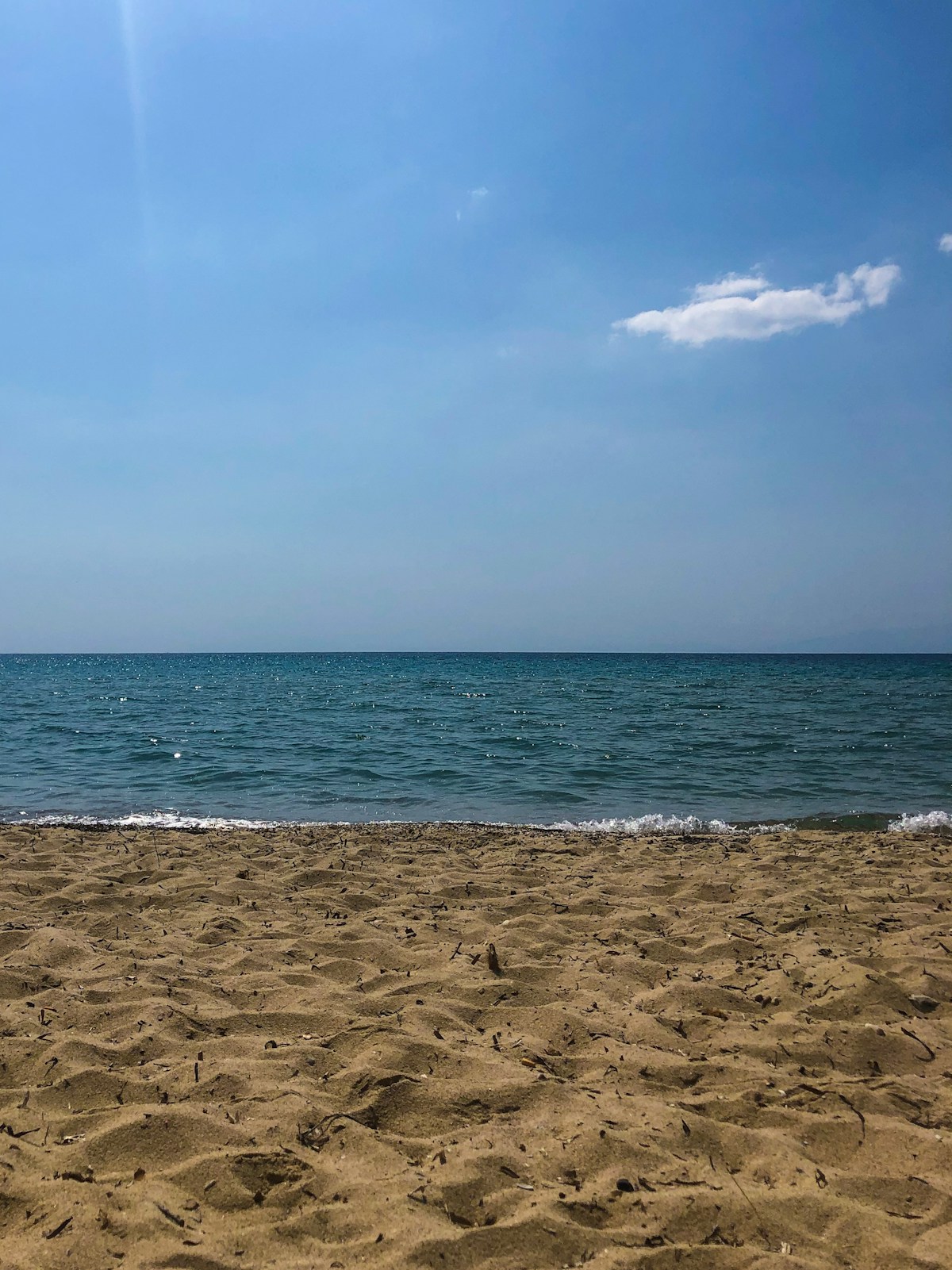 Sandy beach with clear blue water at Kallikrateia, Halkidiki, Greece