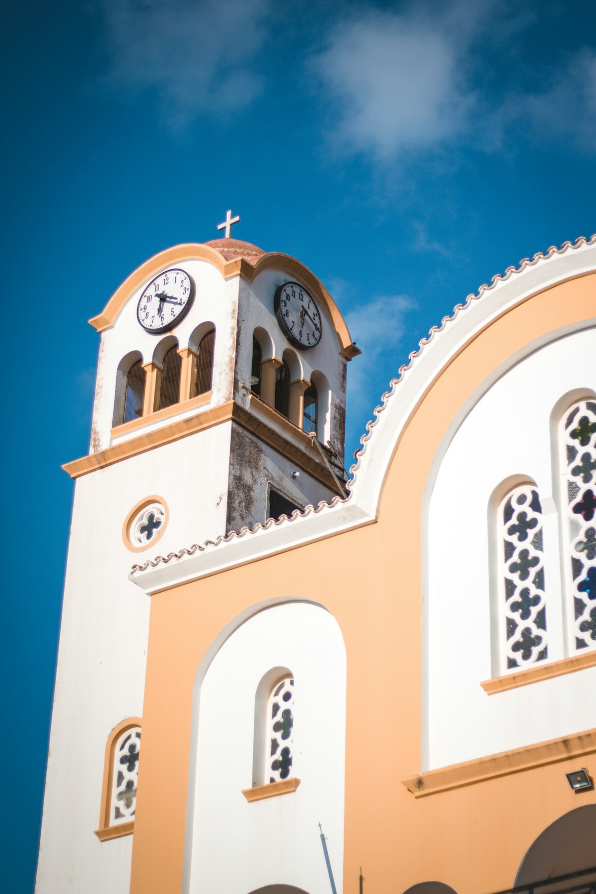 Orthodox church bell tower with clock in the city centre of Heraklion, Crete, Greece