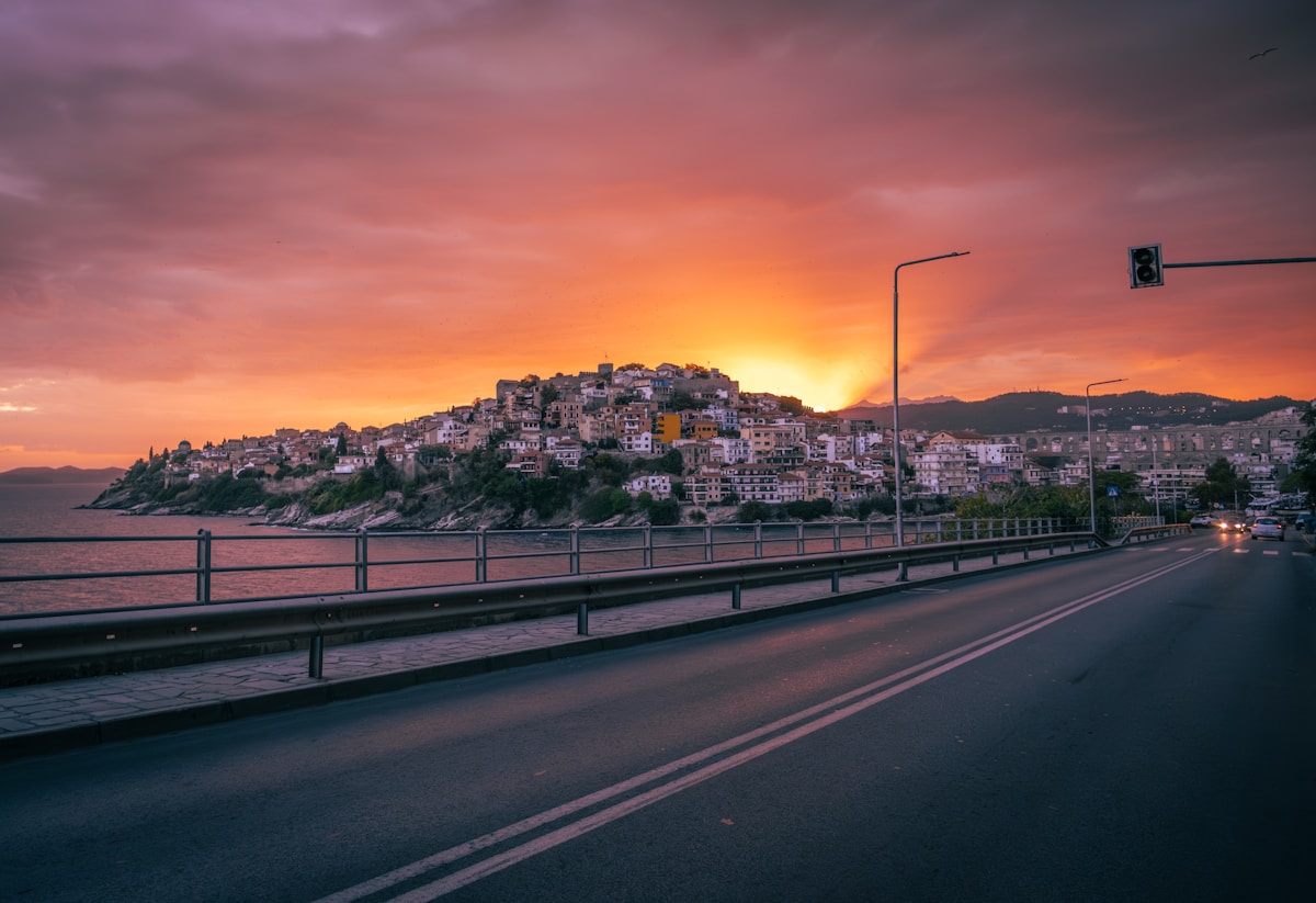 Sunset over Kavala city and harbour with the sea beyond, Greece