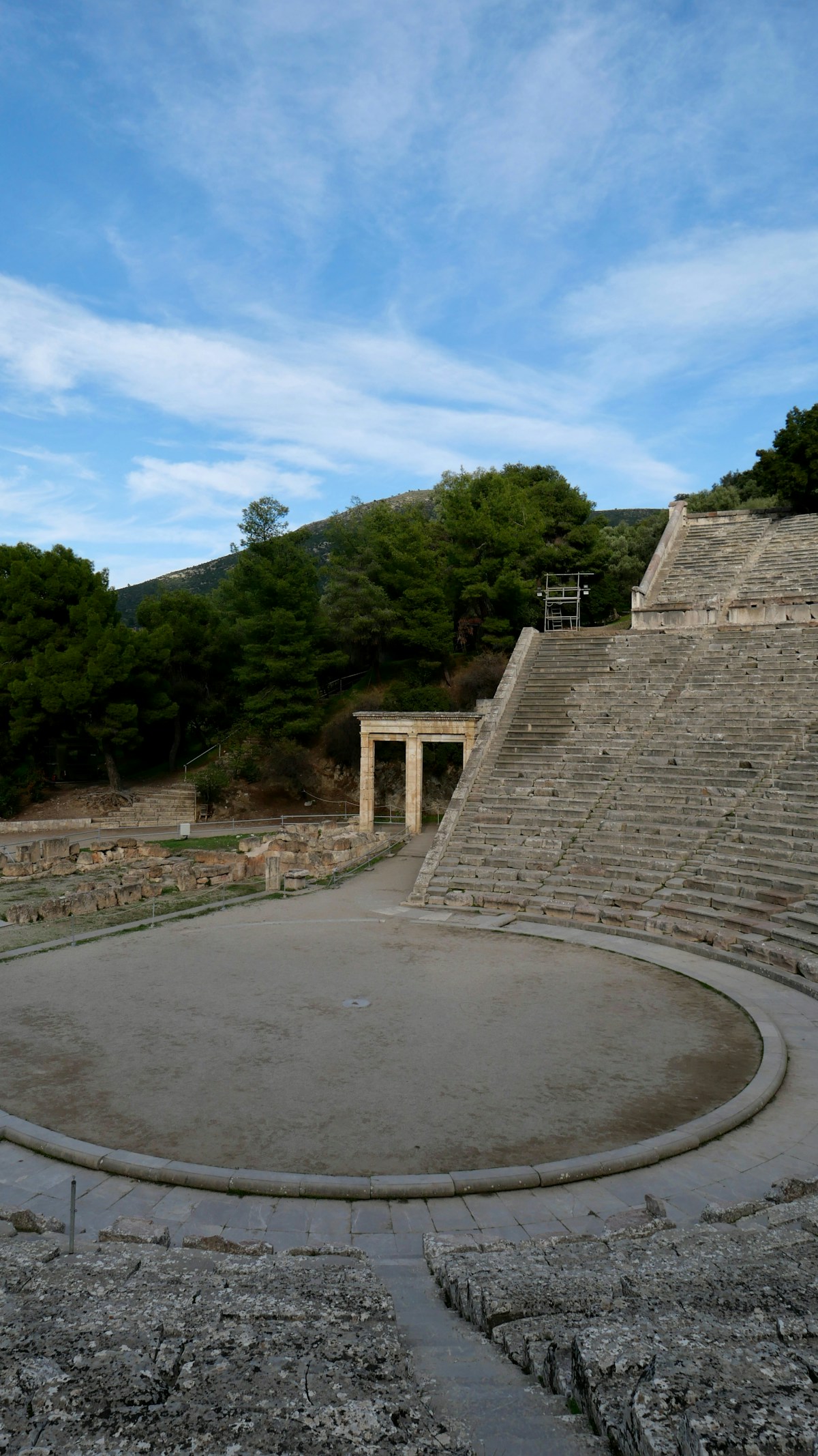Ancient stone amphitheater with tiered seating, Epidauros, Peloponnese, Greece