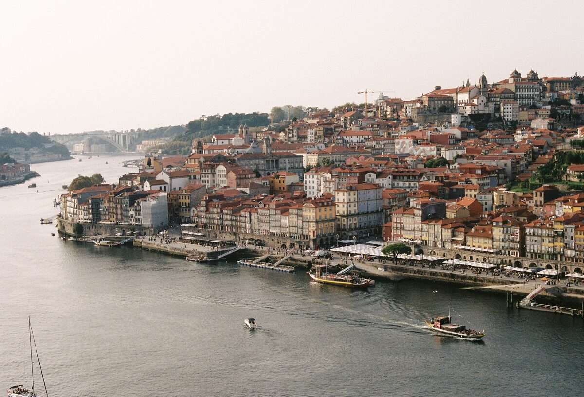 Aerial view of Porto historic riverside with colourful architecture along the Douro River, Portugal