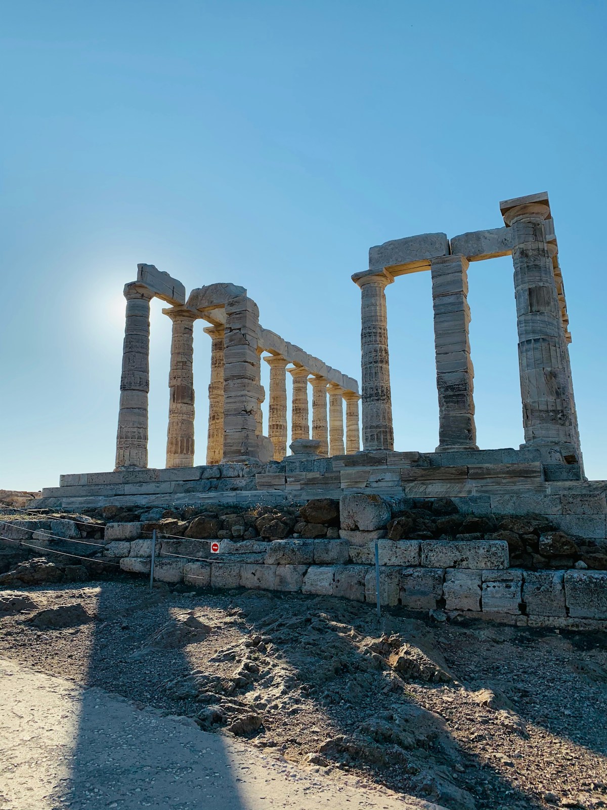 The Temple of Poseidon at Cape Sounion with Doric columns against a clear blue sky