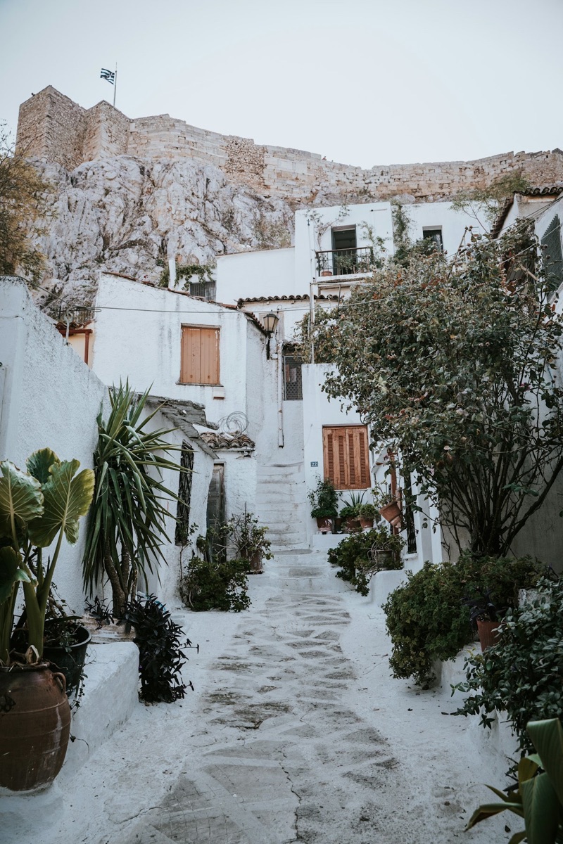 Narrow whitewashed alley below the Acropolis rock in the Anafiotika quarter, Athens, Greece