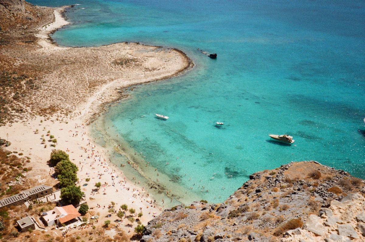 Pink-tinted sand and turquoise lagoon at Elafonisi beach, Crete