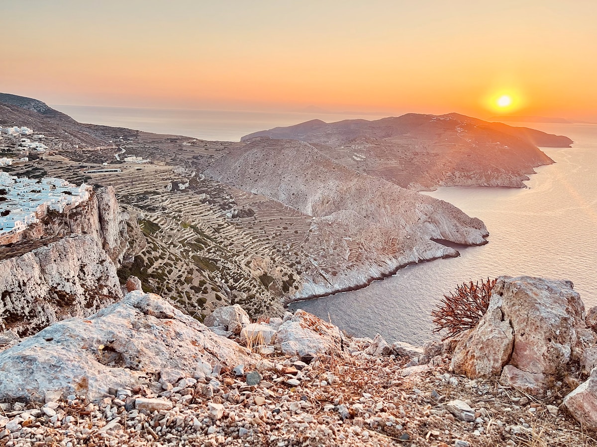 Sunset panorama over the dramatic volcanic cliffs and coastline of Folegandros, Cyclades, Greece