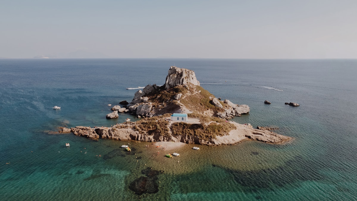 Ancient ruins of the Asklepion on Kos island, Greece, with pine trees and sea views