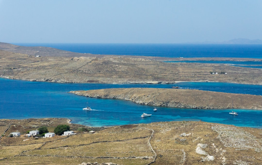Aerial view of Delos island with turquoise waters, Cyclades, Greece