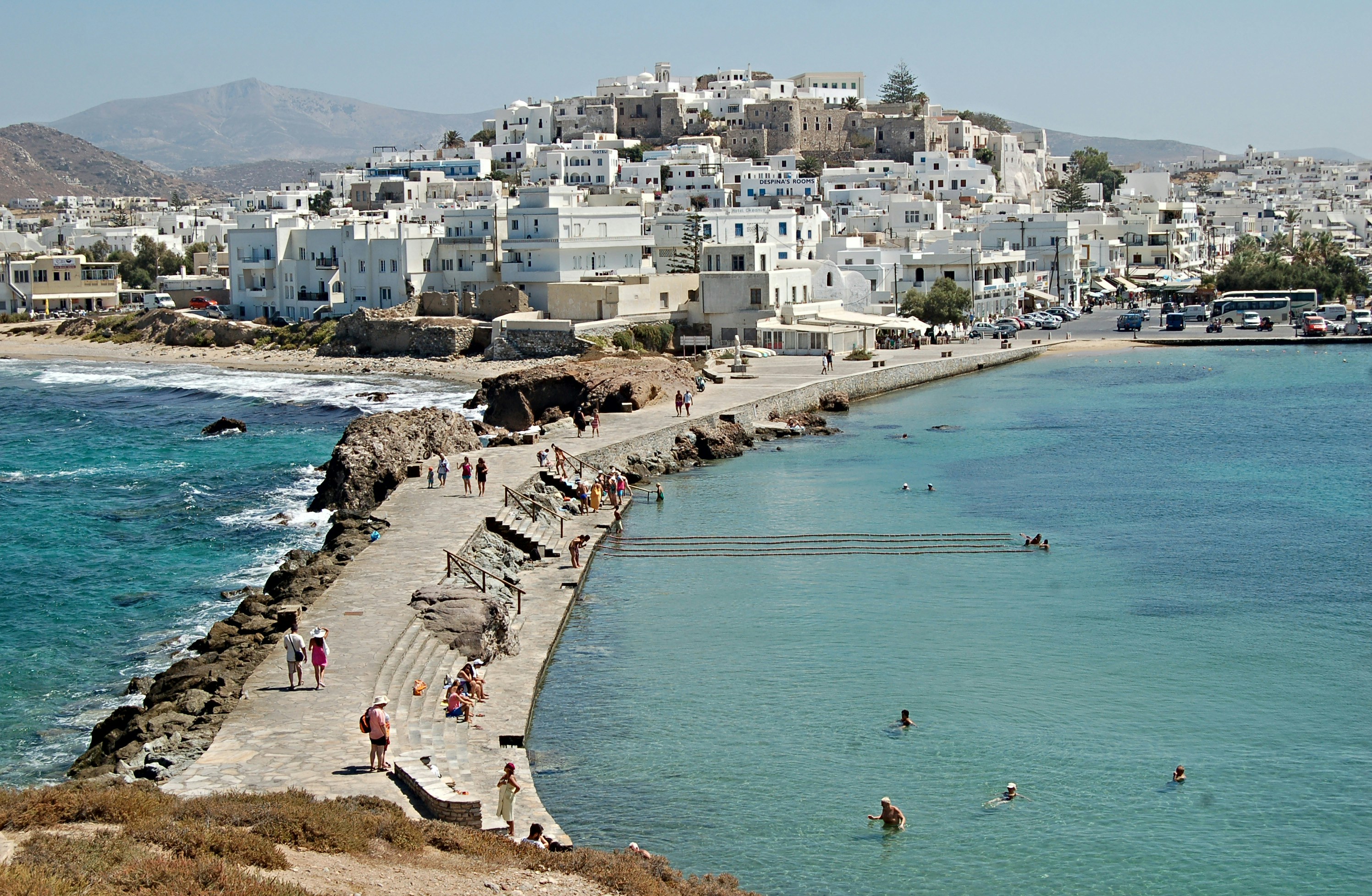 Outdoor taverna table with local Greek dishes and wine on Naxos