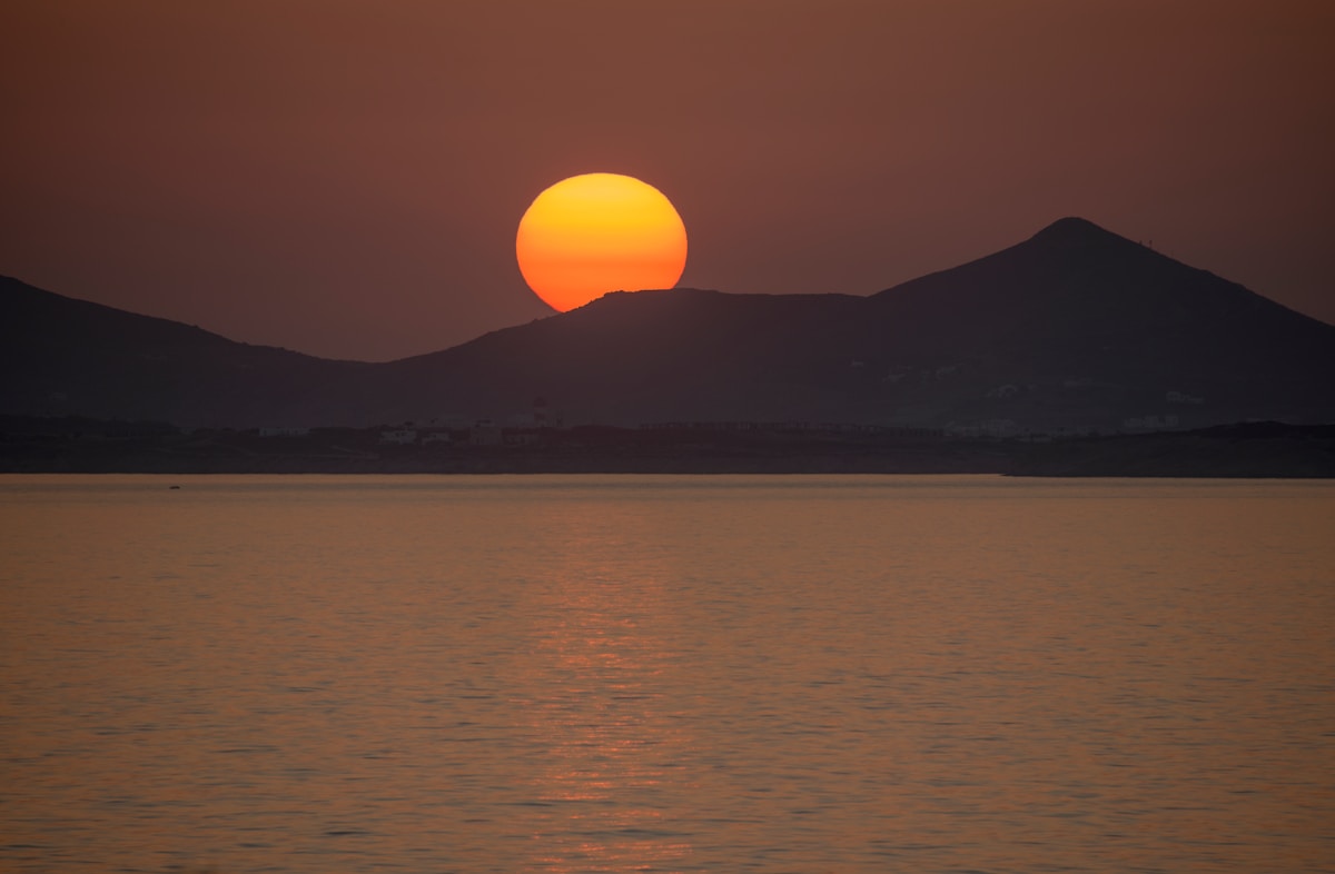 The Portara marble doorway of Naxos at sunset with the Aegean Sea behind