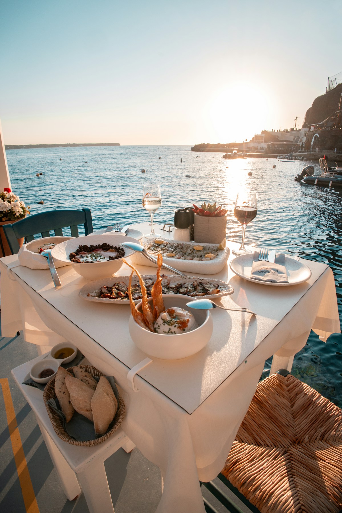 Seafood taverna terrace with caldera views in Santorini, Greece