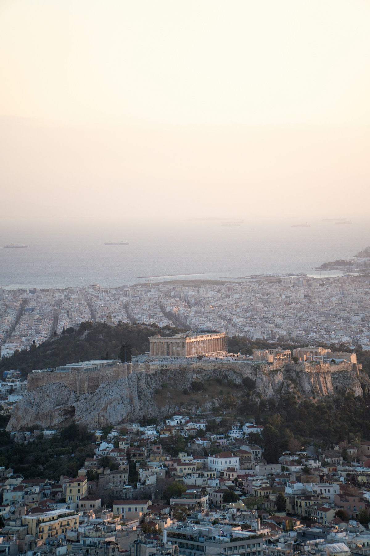 Aerial view of the Acropolis and the Parthenon rising above Athens at dusk
