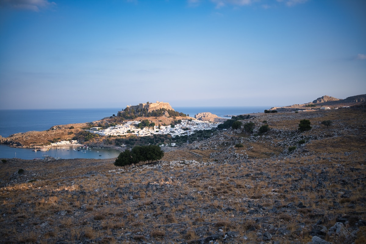 The Acropolis of Athens at sunset with the Parthenon visible against an orange sky