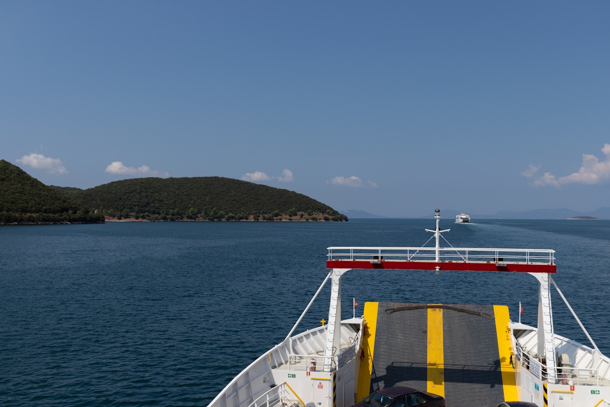 View from a car ferry deck looking out over the Ionian Sea toward green islands, Greece