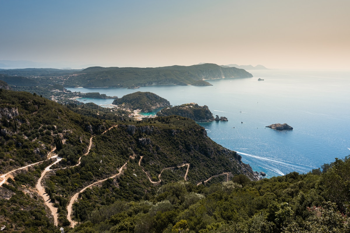 Panoramic coastal view of green hillsides and turquoise bays, Corfu, Greece