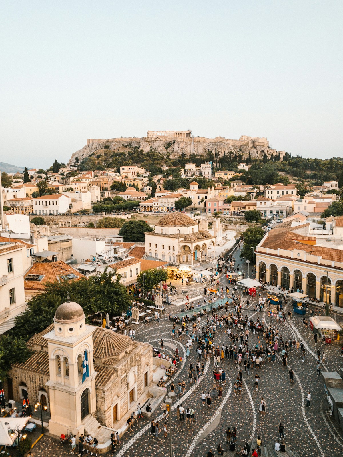 A street café in Athens with locals drinking coffee under an awning