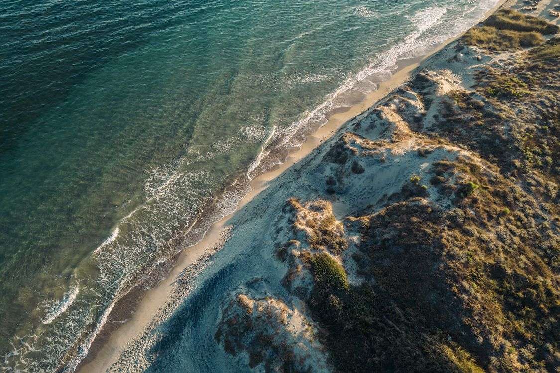 Aerial view of Kos island beach, Greece, with turquoise Aegean Sea and sandy shoreline